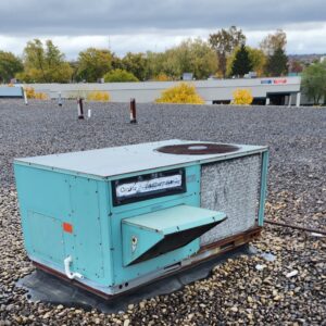 old carrier rooftop air conditioner rtu with hail damage