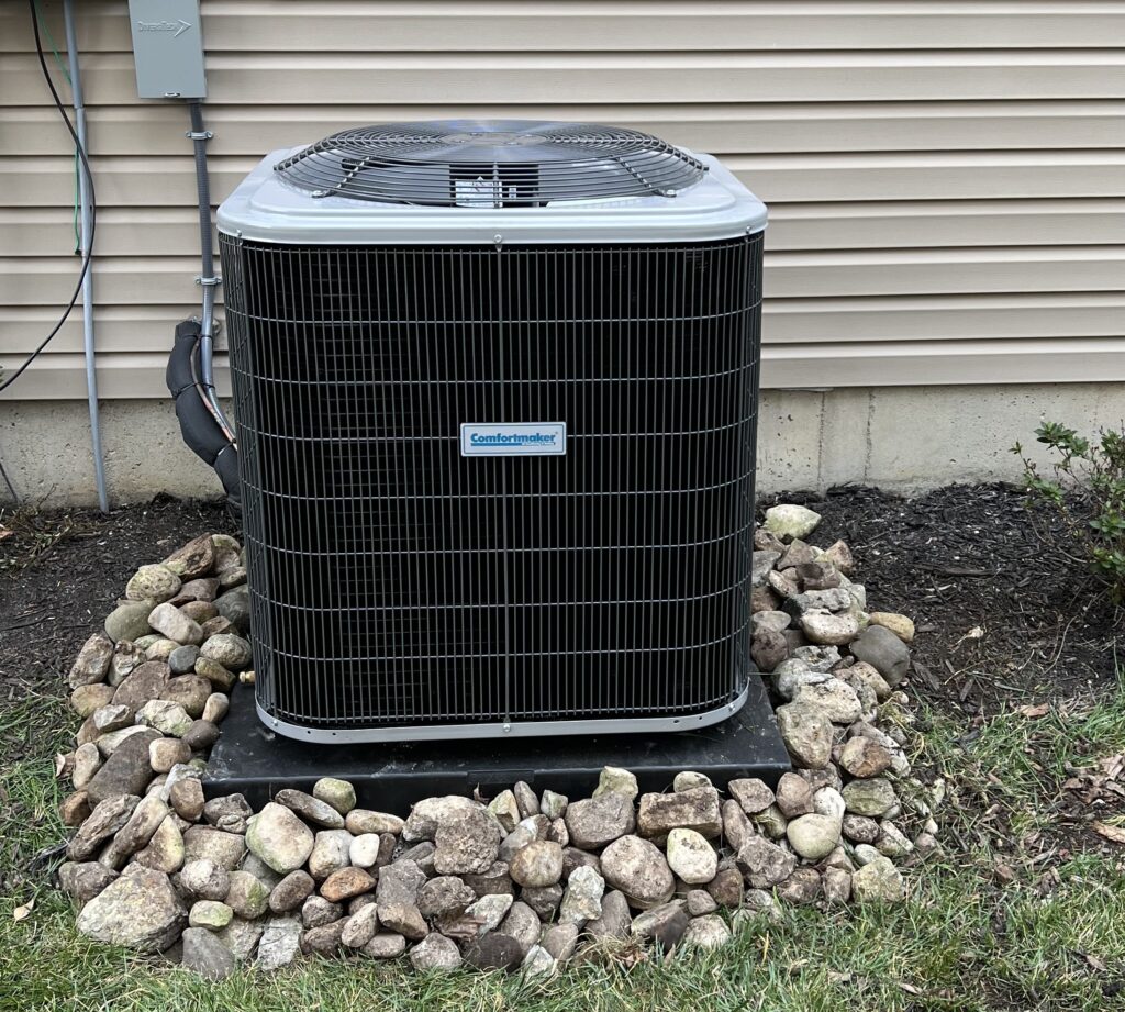 New ComfortMaker Air Conditioning Unit behind home