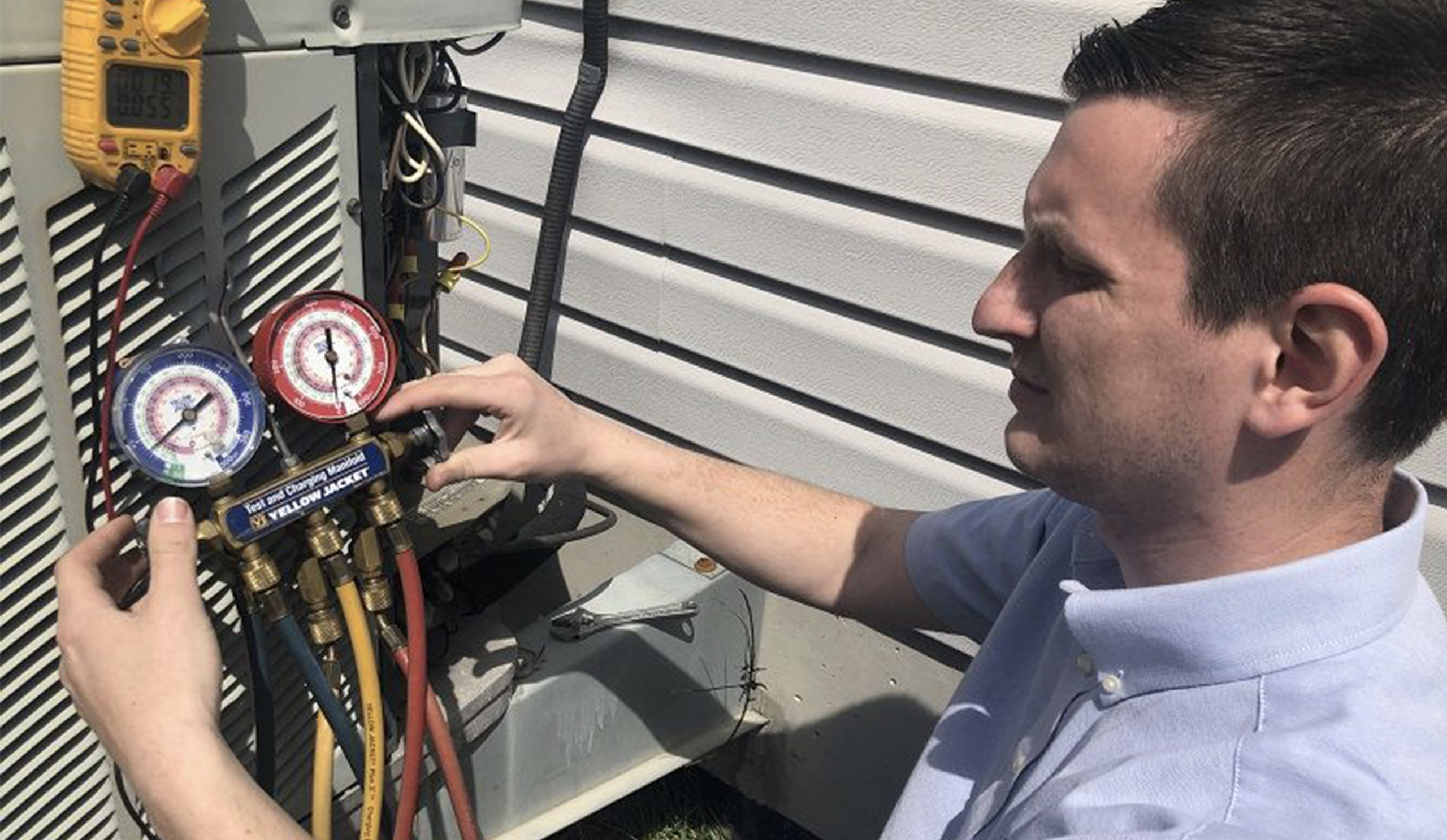Watkins HVAC tech does A/C tune up