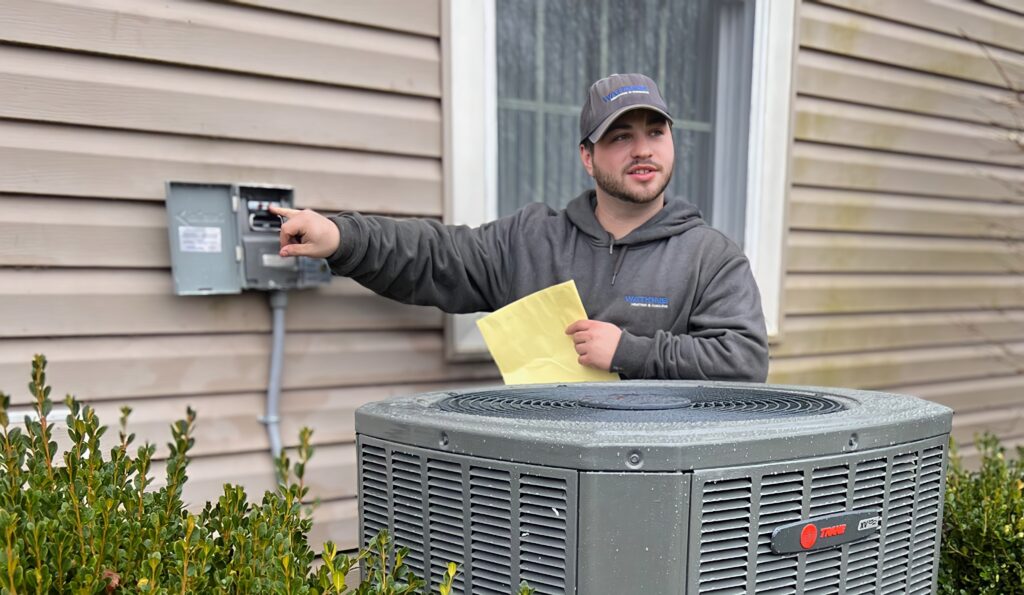 Watkins Tech Explaining New Trane Air Conditioner XR16 Install to Customer