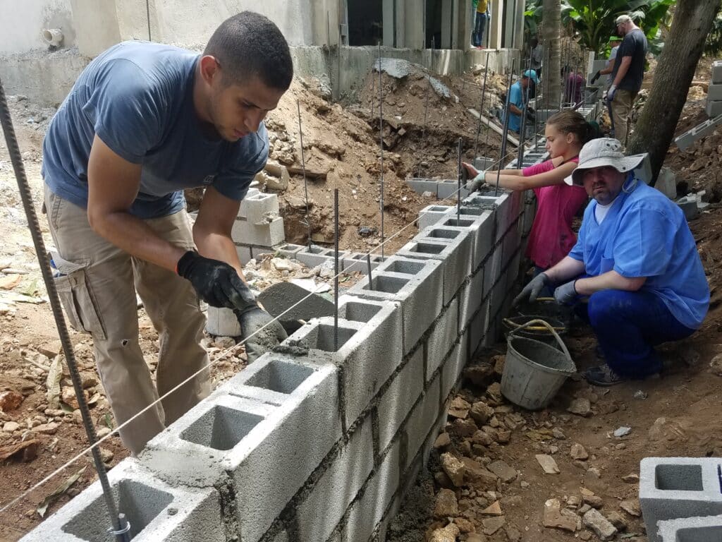 Rafa and John building a wall
